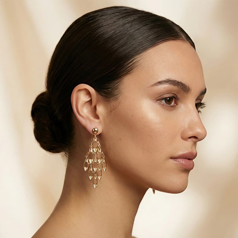 Long gold earrings with a geometric, openwork design, featuring movable charms that sway with your movements, creating a captivating sparkle. A luxurious and modern piece that will turn heads. - Image 3